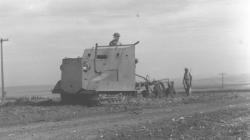 Plouging with armoured tractor 